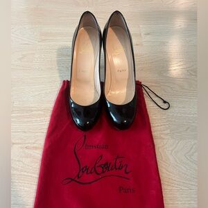 Christian Louboutin black patent round toe pumps